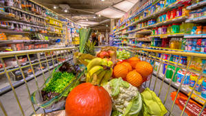 Fresh Assortment Of Fruits And Vegetables In Grocery Store Wallpaper