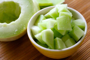 Fresh Honeydew Melon Served In A Bowl Wallpaper