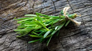 Fresh Sprigs Of Rosemary On Dark Wood Wallpaper