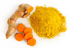 Fresh Turmeric Slices And Powder Wallpaper