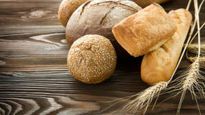 Freshly Baked Artisan Bread With Wheat Wallpaper