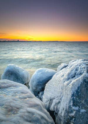 Frozen Stones By Coast Wallpaper