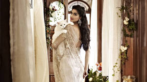 Gentle Sonam Kapoor With Cat Wallpaper