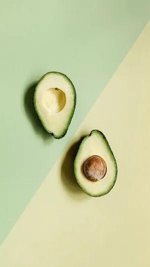 Get A New Perspective Of Your Phone With An Avocado Iphone Wallpaper Wallpaper