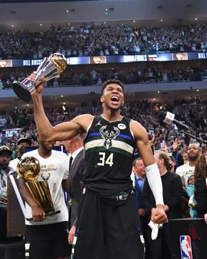Giannis Antetokounmpo Mvp And Champion Wallpaper