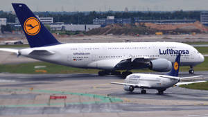 Giant And Mini Deutsche Lufthansa Airplanes Wallpaper