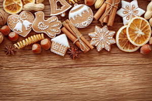 Gingerbread On Wooden Table Wallpaper