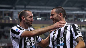 Giorgio Chiellini And Leonardo Bonucci Juventus Hug Wallpaper