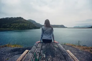 Girl Gazing At Serene Waters Wallpaper