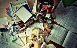Girl Learning With Messy Desk Wallpaper