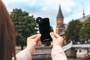 Girl Taking A Photo Wallpaper