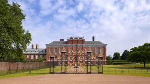 Glimpse Of Magnificent Kensington Palace From The Outside Gates Wallpaper