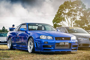 Glossy Blue Nissan Skyline Gtr R34 Wallpaper