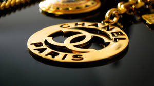 Gold Chanel Logo Pendant Wallpaper