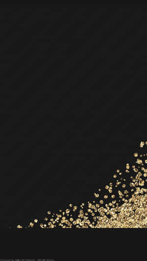 Gold Flakes Falling On A Black Background Wallpaper