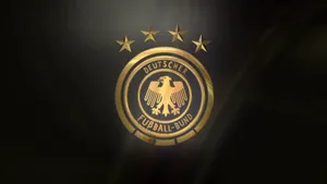 Golden Germany National Football Team Logo Black Graphic Wallpaper