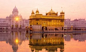 Golden Temple With Reflected Sun Wallpaper