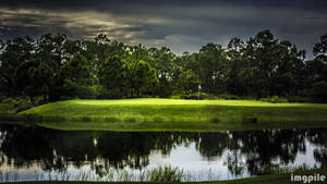 Golf Course And Dark Clouds Wallpaper