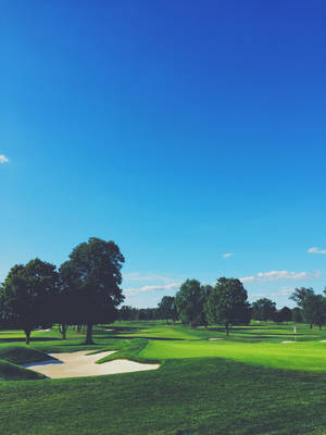 Golf Course Under Clear Sky Wallpaper