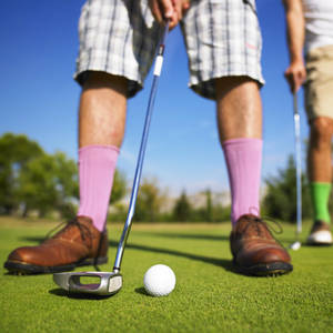 Golf Player Legs On Golf Course Wallpaper