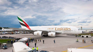 Google Flights Emirates Plane Parked Wallpaper