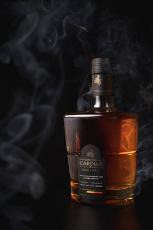 Gouden Carolus Round Whiskey Bottle Wallpaper