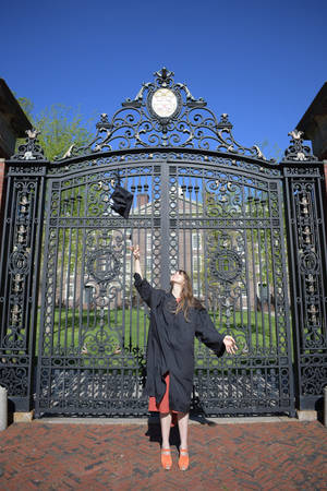 Graduate Posing At Brown University Gate Wallpaper