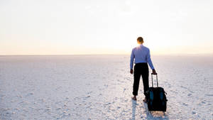 Gray Road Journey Of Man With Luggage Wallpaper