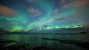 Green Aurora Borealis On The Starry Night Sky Wallpaper. Wallpaper Wallpaper