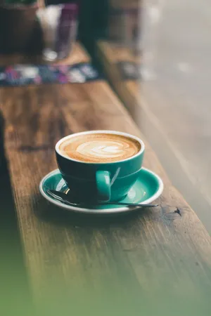 Green Coffee Cup On Wood Aesthetic Wallpaper