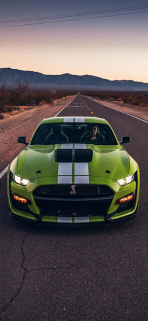 Green Mustangon Desert Road Wallpaper