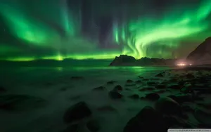 Green Sky With Rocky Sea Shore Wallpaper