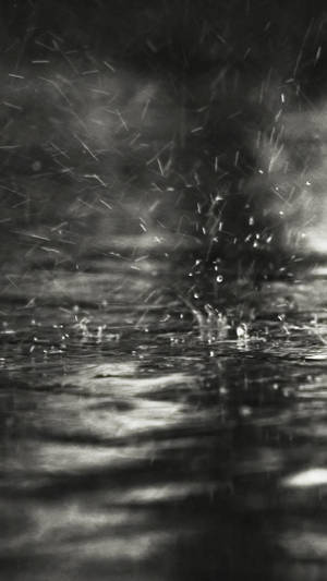 Grey Iphone Rain On Puddles Wallpaper