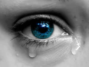 Greyscale Blue Eye Crying With Tears Wallpaper