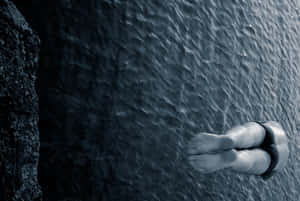 Greyscale Of Male Feet Diving Wallpaper