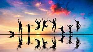 Group Jump Shot On Water Wallpaper