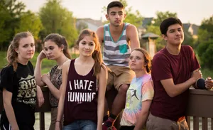 Group Of Friends Beside Wooden Fence Wallpaper