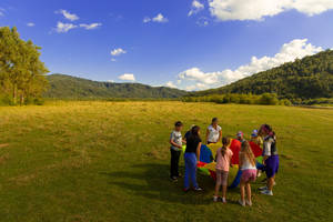 Group Of People Playing Outdoors Wallpaper