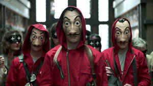 Group Wearing Money Heist Mask Wallpaper