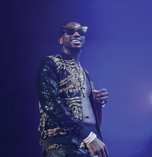 Gucci Mane Performingon Stage Wallpaper
