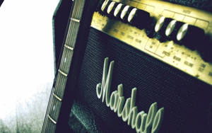 Guitar Leaning On Marshall Amplifier Wallpaper