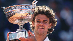 Gustavo Kuerten Carrying His Trophy Wallpaper