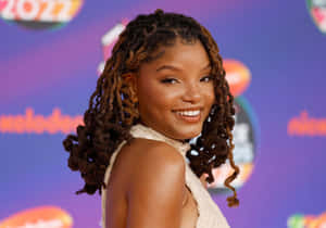 Halle Bailey Smilingat Awards Event Wallpaper