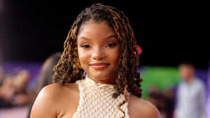 Halle Bailey Smilingat Event Wallpaper