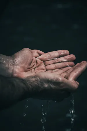Hands With Water Wallpaper