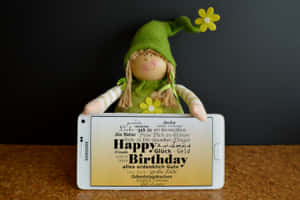 Happy Birthday Dollwith Tablet Wallpaper