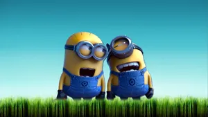 Happy Minions In Grass Wallpaper