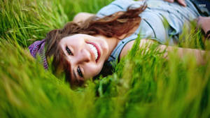 Happy Woman On Grass Wallpaper