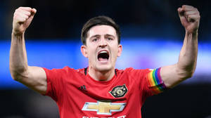 Harry Maguire Cheers With Both Arms Raised Wallpaper