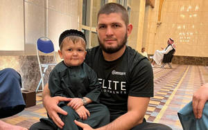 Hasbulla Held By Khabib Wallpaper